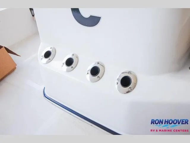 Slide: The Image of Catalyst Boat Works 2300 BAY 2023 model with rod holders, Ron Hoover branding visible. - 28