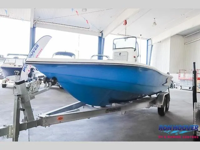 Slide: The Image of 2023 Catalyst Boat Works 2300 BAY in showroom, blue hull on trailer. - 29