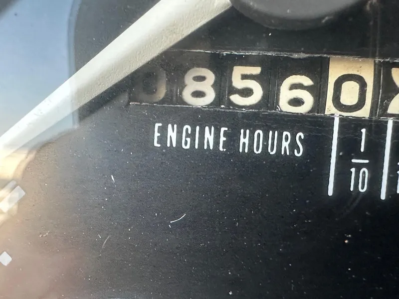 Slide: The Image of 1968 Chris-Craft 35 Commander engine hours gauge showing 8560 hours. - 16