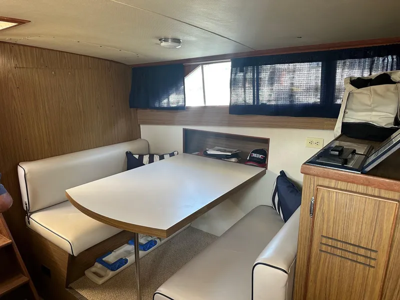 Slide: The Image of Interior of a 1968 Chris-Craft 35 Commander boat with dining table. - 19