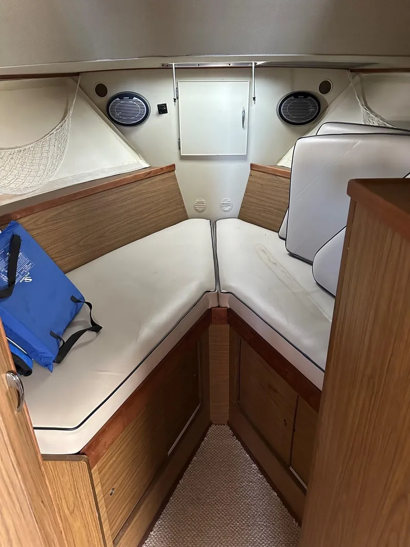 Slide: The Image of 1968 Chris-Craft 35 Commander interior with white upholstery. - 20