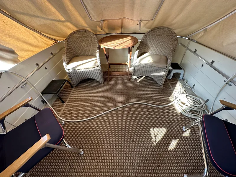 Slide: The Image of Interior of a 1968 Chris-Craft 35 Commander with seating area. - 23