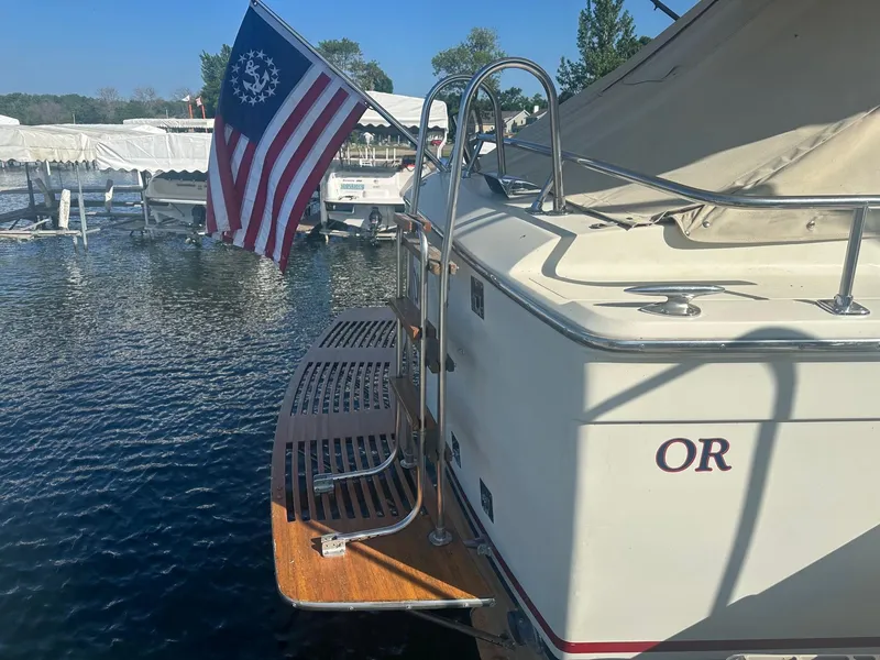 Slide: The Image of Rear view of 1968 Chris-Craft 35 Commander with flag. - 28