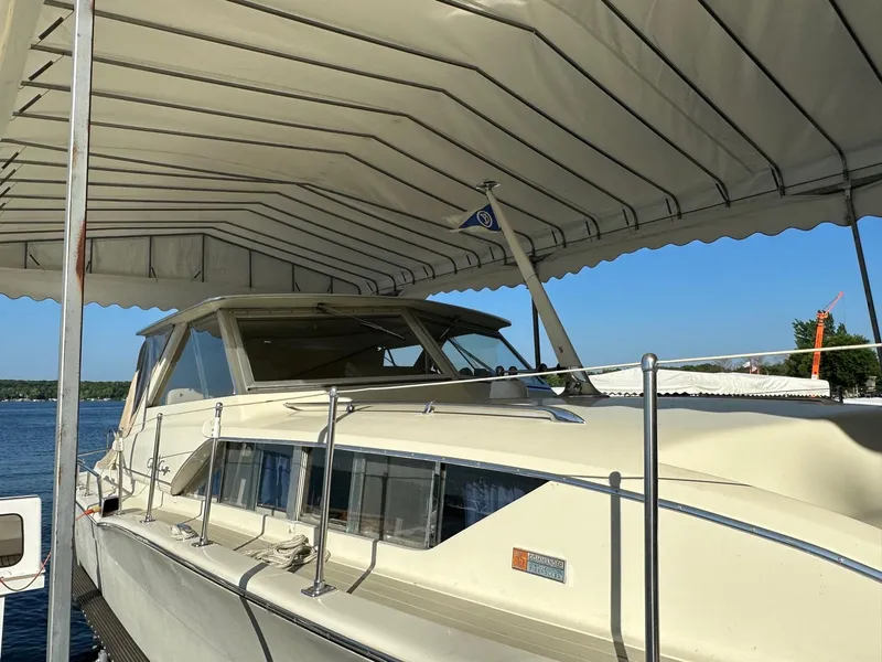 Slide: The Image of 1968 Chris-Craft 35 Commander under a boat canopy. - 30