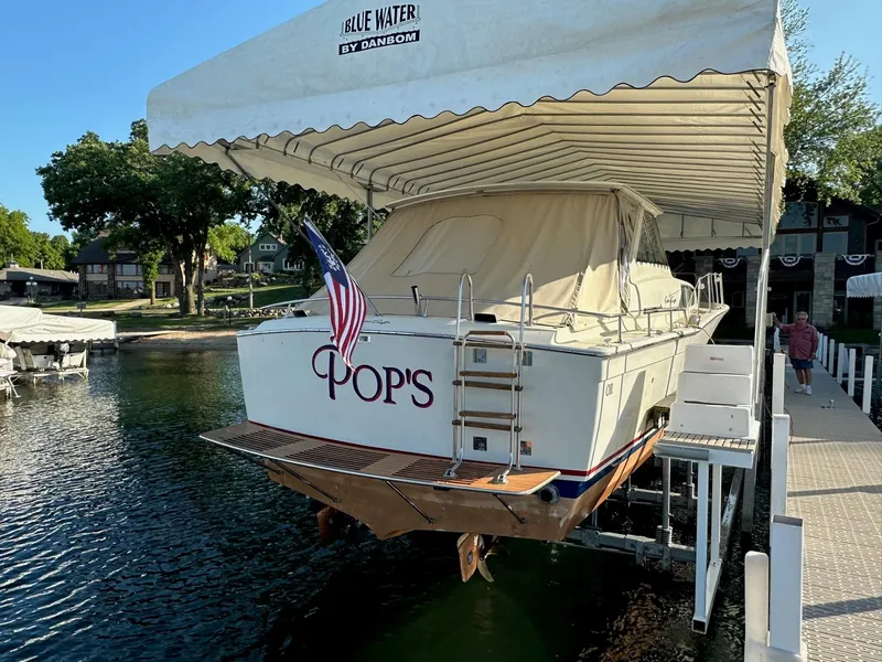 Slide: The Image of 1968 Chris-Craft 35 Commander boat under a dock canopy. - 31