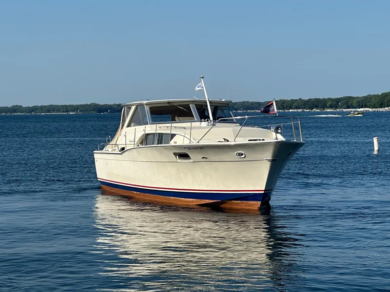 Slide: The Image of 1968 Chris-Craft 35 Commander on calm water. - 4