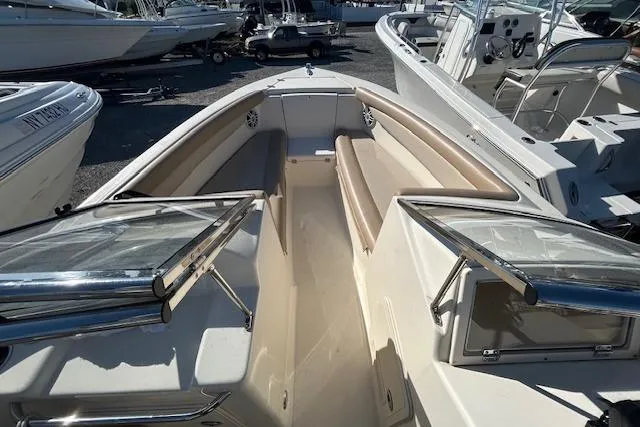 Slide: The Image of 2023 Scout 210 Dorado boat interior with open bow seating and sleek design. - 7