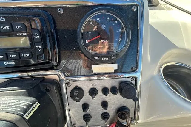 Slide: The Image of Dashboard of 2023 Scout 210 Dorado boat with RPM gauge and control panel. - 8