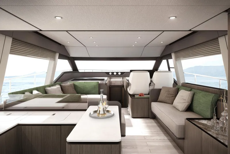 Slide: The Image of Luxurious interior of 2024 Ferretti Yachts 580 with modern seating and panoramic windows. - 10