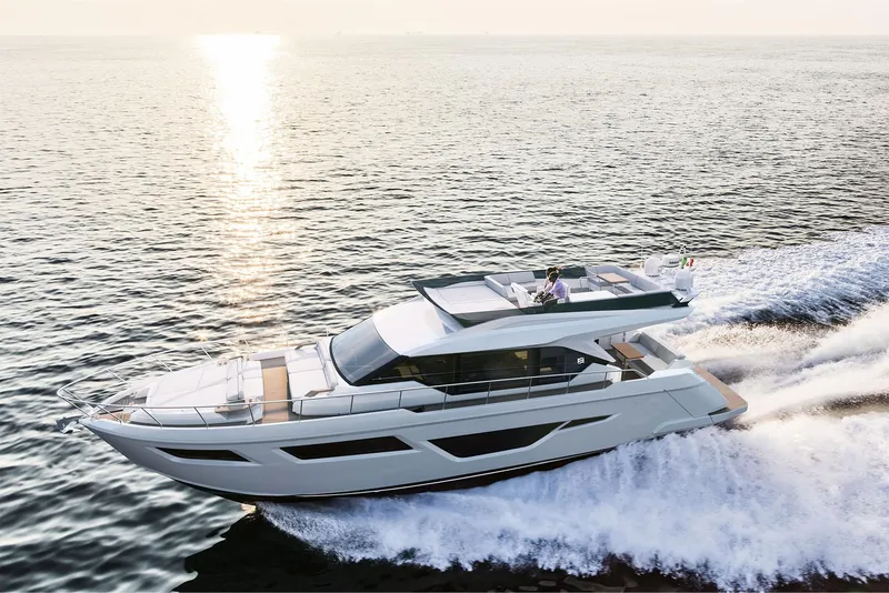 Slide: The Image of 2024 Ferretti Yachts 580 cruising on open water at sunset. - 4