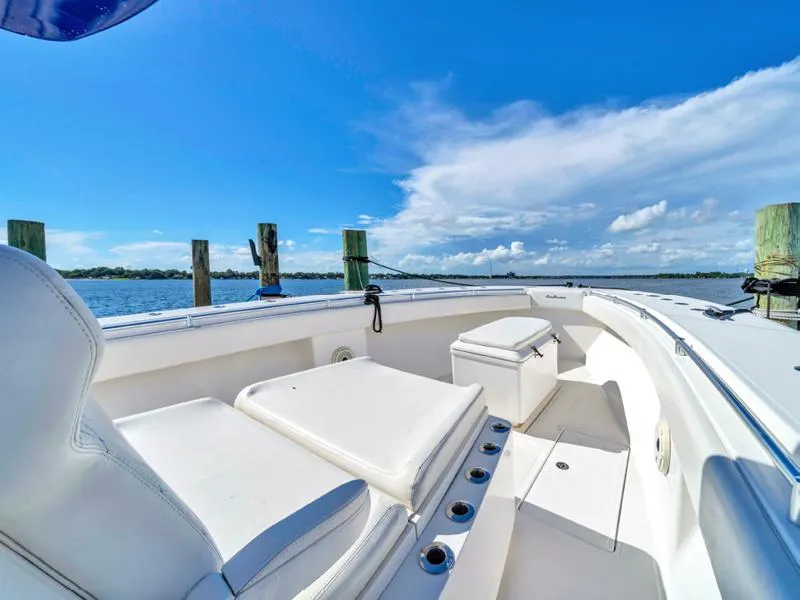 Slide: The Image of SeaHunter 45 boat interior, 2015 model, with white seating and ocean view. - 13