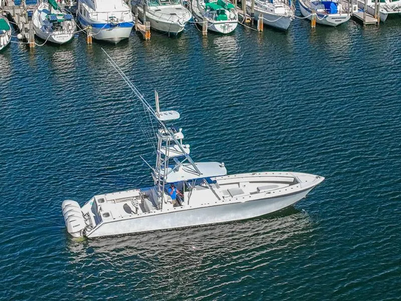Slide: The Image of 2015 SeaHunter 45 boat in marina, surrounded by other boats. - 3