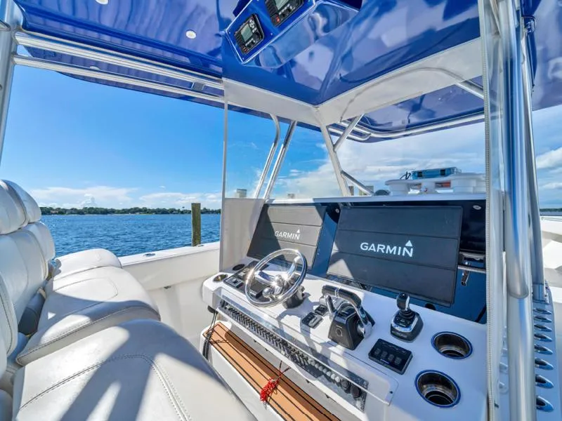 Slide: The Image of SeaHunter 45 2015 boat cockpit with Garmin navigation system and blue canopy. - 7