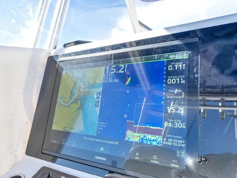 Slide: The Image of Garmin navigation display on a 2015 SeaHunter 45 boat showing GPS and sonar data. - 9