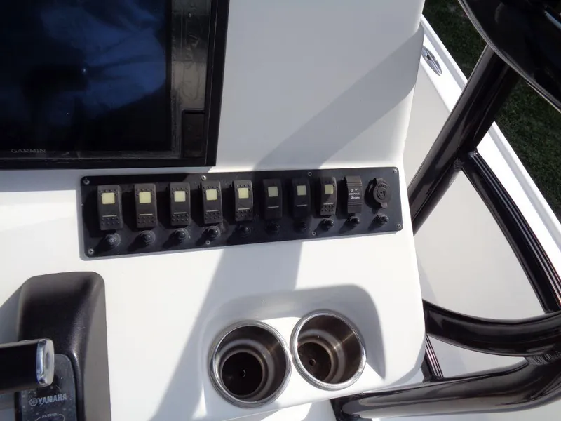 Slide: The Image of Control panel of a 2011 Cape Horn 23 Cape Bay boat with cup holders. - 13