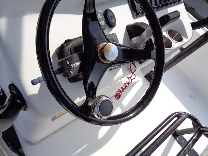 Slide: The Image of Steering wheel and controls of a 2011 Cape Horn 23 Cape Bay boat. - 17