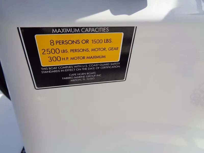 Slide: The Image of 2011 Cape Horn 23 Cape Bay maximum capacities label: 8 persons, 1500 lbs, 2500 lbs total, 300 - 18