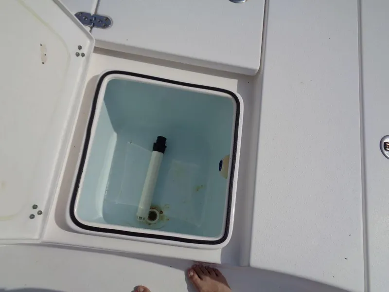 Slide: The Image of Open storage compartment on a 2011 Cape Horn 23 Cape Bay boat. - 22