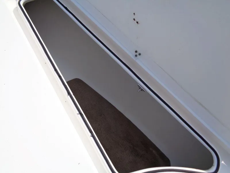 Slide: The Image of Open storage compartment on a 2011 Cape Horn 23 Cape Bay boat. - 25