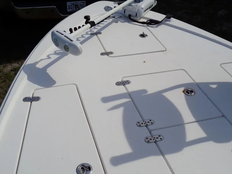 Slide: The Image of 2011 Cape Horn 23 Cape Bay boat deck with storage compartments and trolling motor. - 28