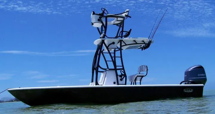 Slide: The Image of 2011 Cape Horn 23 Cape Bay boat on water with clear blue sky. - 3