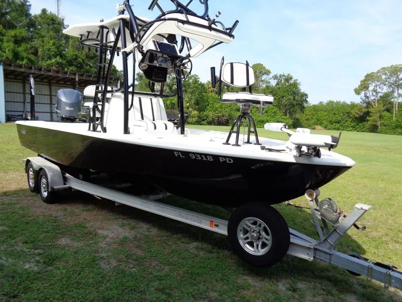 Slide: The Image of 2011 Cape Horn 23 Cape Bay boat on a trailer in a grassy area. - 33