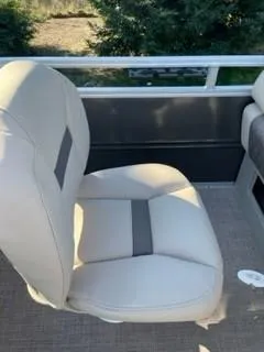 Slide: The Image of 2024 Sun Tracker Fishin' Barge 20 DLX boat seat with beige upholstery. - 12