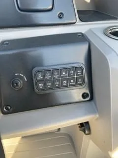 Slide: The Image of Control panel of 2024 Sun Tracker Fishin' Barge 20 DLX boat. - 14