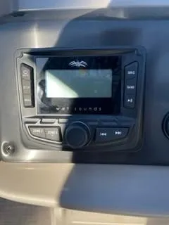 Slide: The Image of 2024 Sun Tracker Fishin' Barge 20 DLX audio control panel. - 15