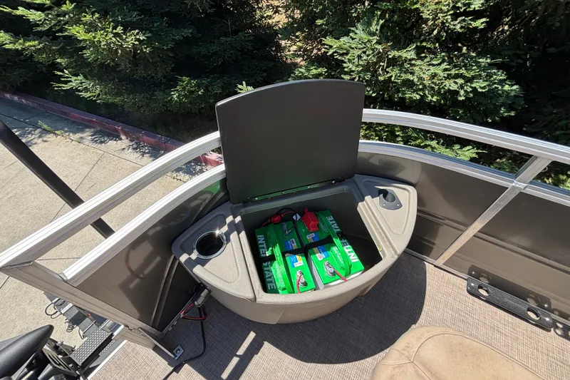 Slide: The Image of 2024 Sun Tracker Fishin' Barge 20 DLX battery compartment with Interstate batteries. - 18