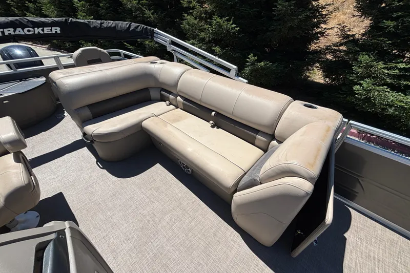 Slide: The Image of 2024 Sun Tracker Fishin' Barge 20 DLX pontoon boat with beige seating and spacious deck. - 39