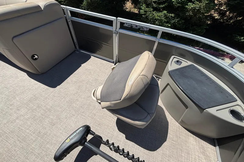 Slide: The Image of 2024 Sun Tracker Fishin' Barge 20 DLX interior with seating and fishing station. - 36