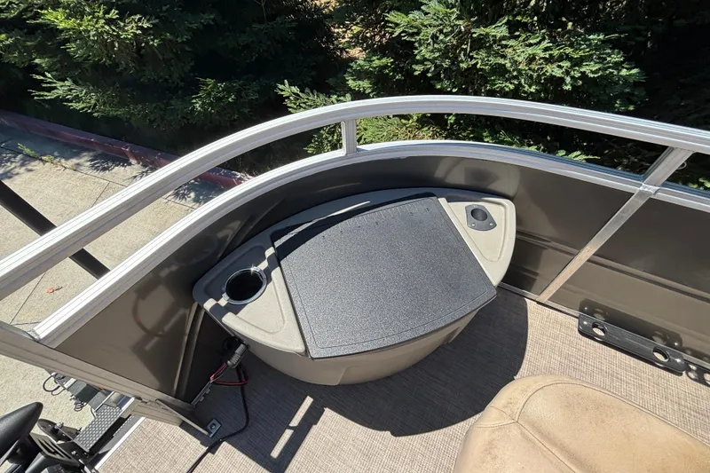 Slide: The Image of 2024 Sun Tracker Fishin' Barge 20 DLX deck with storage and cup holder. - 17