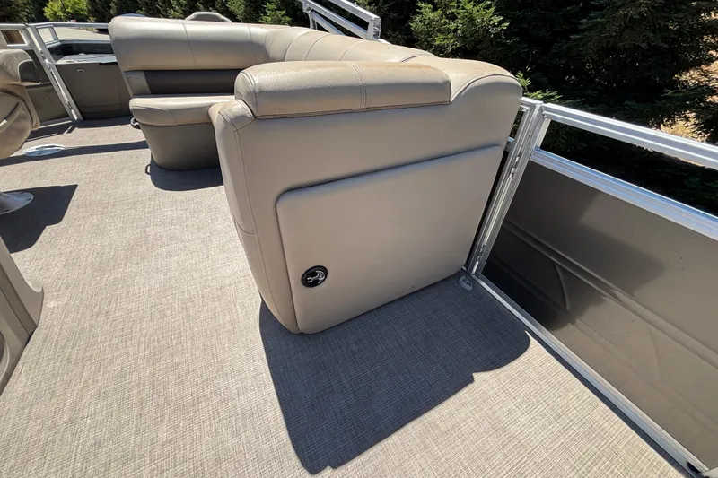 Slide: The Image of 2024 Sun Tracker Fishin' Barge 20 DLX interior seating with beige upholstery. - 37
