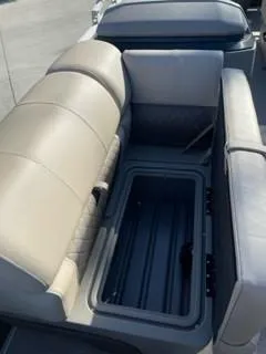 Slide: The Image of 2024 Sun Tracker Fishin' Barge 20 DLX seating and storage compartment. - 9