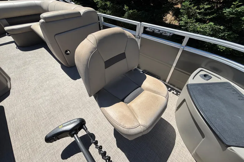 Slide: The Image of 2024 Sun Tracker Fishin' Barge 20 DLX interior with comfortable seating and fishing equipment. - 35