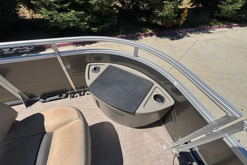 Slide: The Image of 2024 Sun Tracker Fishin' Barge 20 DLX deck with seating and storage area. - 33