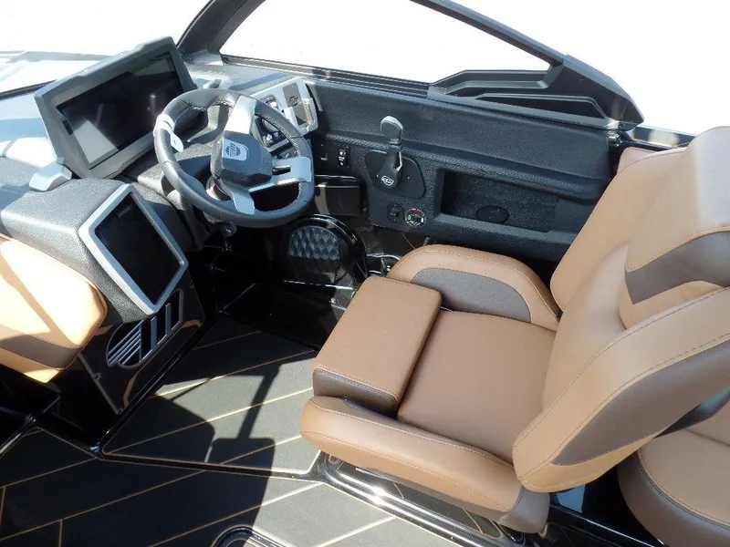 Slide: The Image of 2024 Malibu 23 LSV interior with modern dashboard and tan seating. - 10