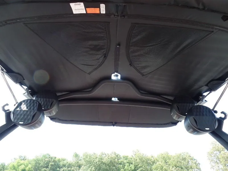 Slide: The Image of 2024 Malibu 23 LSV boat canopy with speakers, viewed from below. - 11