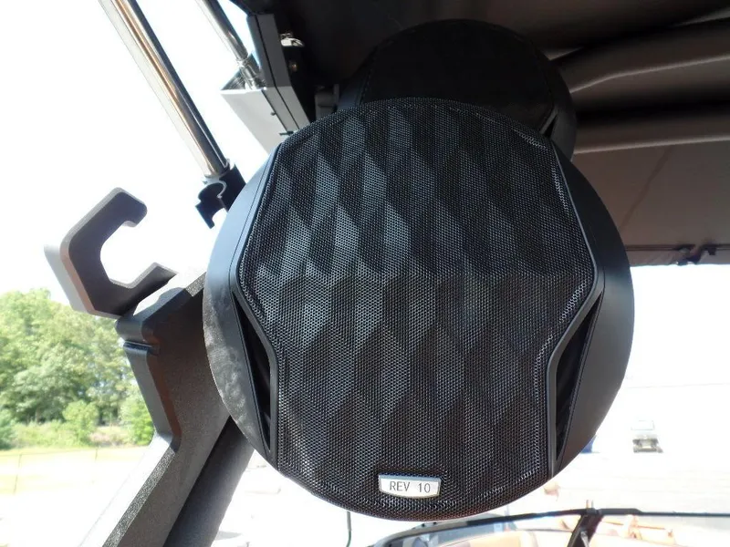 Slide: The Image of 2024 Malibu 23 LSV boat speaker, close-up view, mounted under canopy. - 12