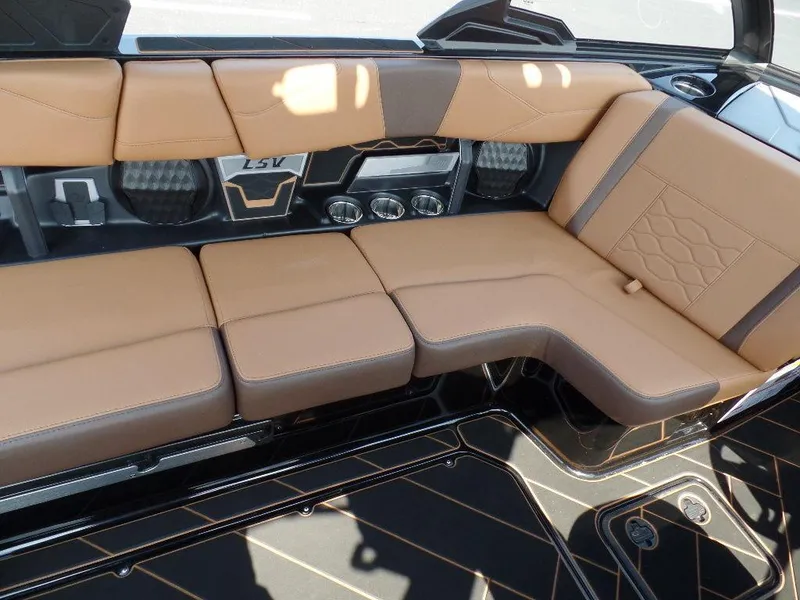 Slide: The Image of 2024 Malibu 23 LSV interior with tan leather seating and modern design. - 7
