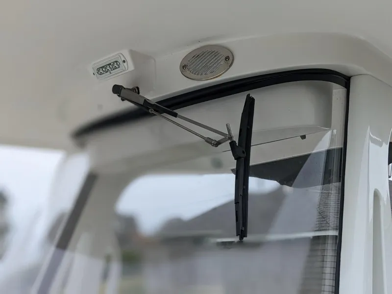 Slide: The Image of Close-up of 2021 Edgewater 262 CC windshield wiper and speaker. - 10