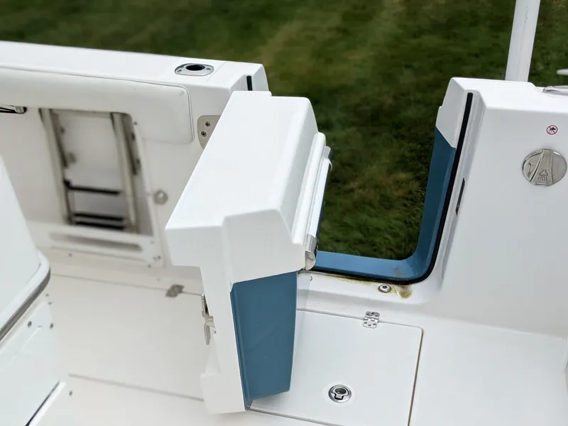 Slide: The Image of 2021 Edgewater 262 CC boat with open side door and ladder. - 13