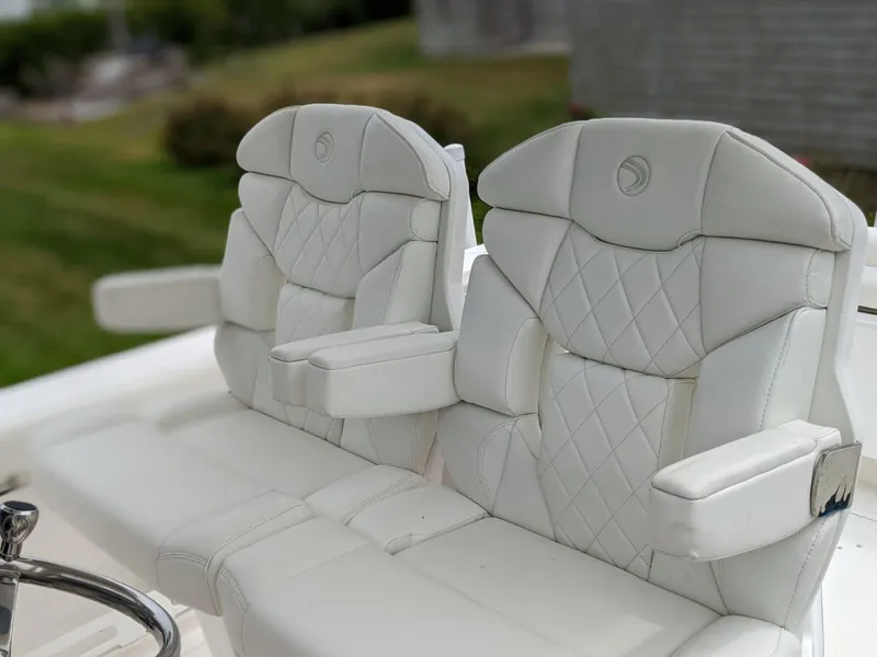 Slide: The Image of 2021 Edgewater 262 CC boat with white leather seats. - 9