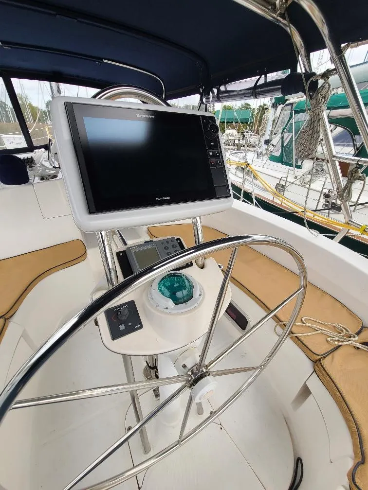 Slide: The Image of Steering wheel and navigation equipment on a 2004 Hunter 466 sailboat. - 3