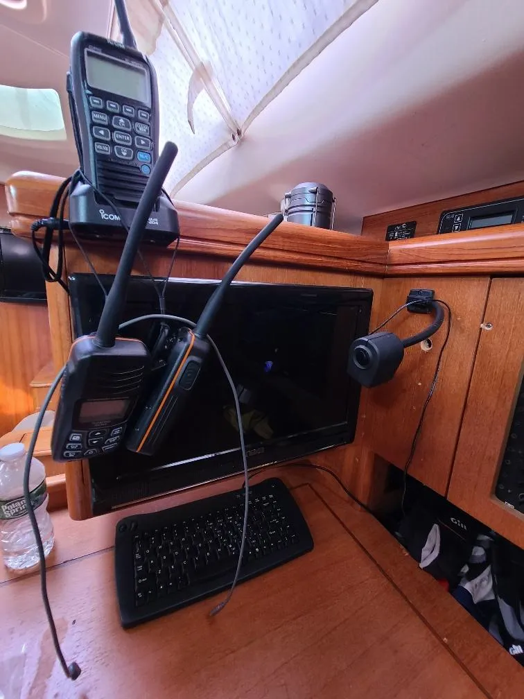 Slide: The Image of Interior of a 2004 Hunter 466 yacht with communication devices and a keyboard. - 38