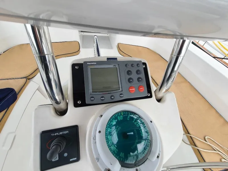 Slide: The Image of Control panel of a 2004 Hunter 466 sailboat with navigation instruments. - 4