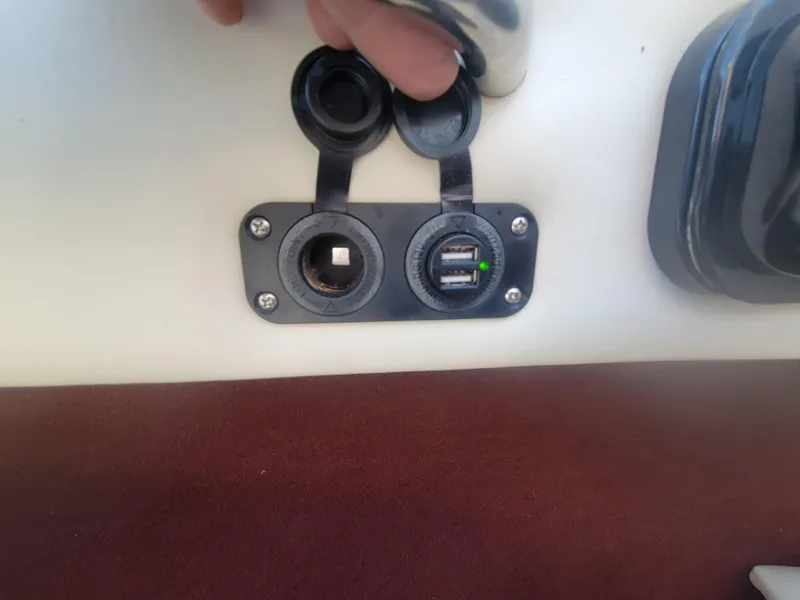 Slide: The Image of 1991 Maxum 2100 XC boat dashboard with USB and 12V power outlets. - 13