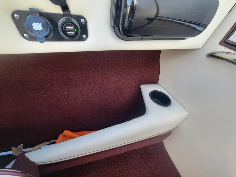 Slide: The Image of Interior of a 1991 Maxum 2100 XC boat with USB ports and cup holder. - 14