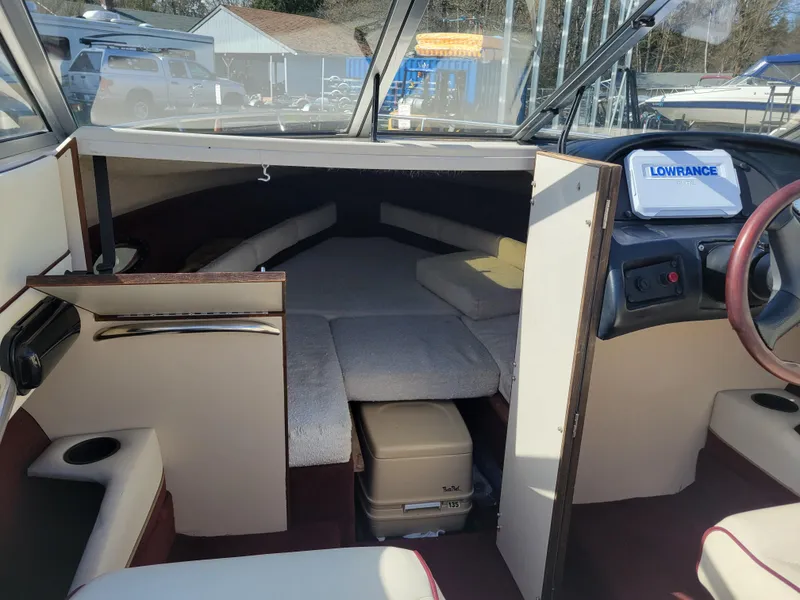 Slide: The Image of 1991 Maxum 2100 XC boat interior with cabin and Lowrance Elite navigation system. - 15